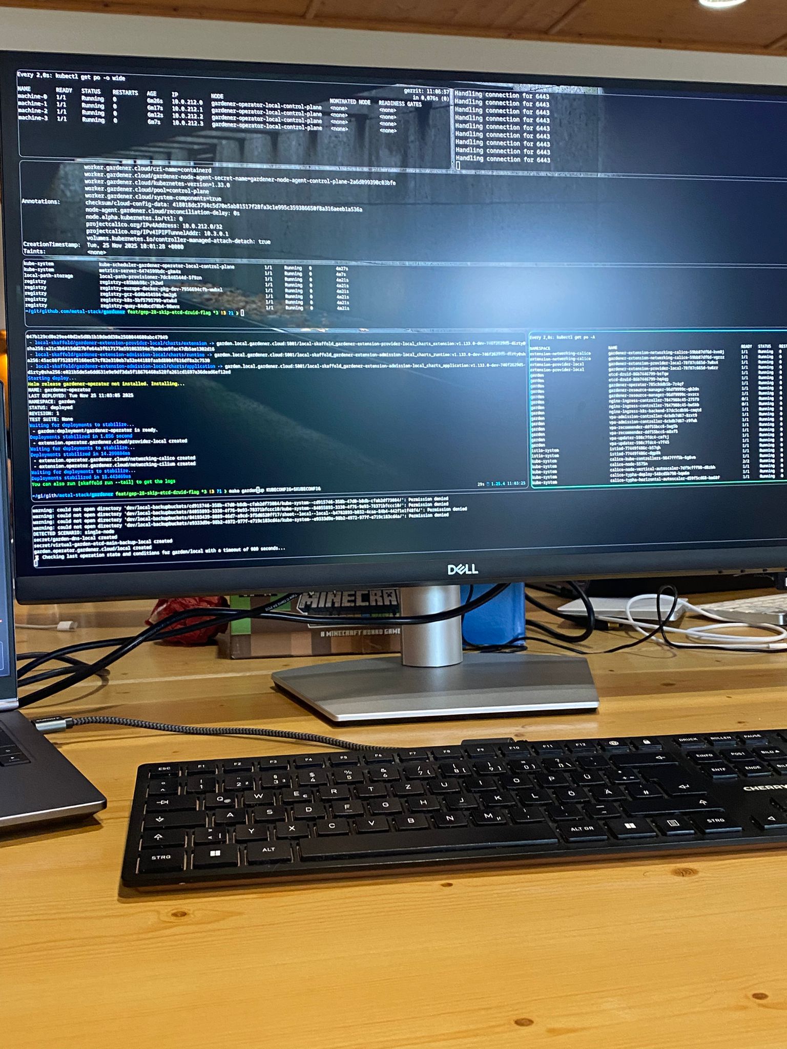 Desk covered in laptops and monitors